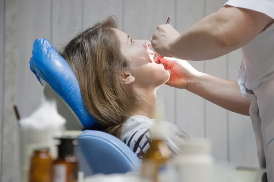 Patient receiving cold sore laser treatment in Burlington dental clinic